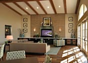 Thumbnail 74 of 117 - A living room with a brown couch and a television on a black stand.