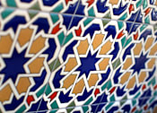 Thumbnail 15 of 45 - A close up of a pattern with blue and orange shapes.