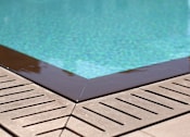 Thumbnail 18 of 45 - A pool with a brown border.
