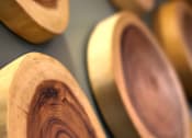 Thumbnail 23 of 45 - A collection of wooden bowls with varying shades of brown and gold.