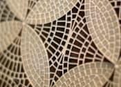 Thumbnail 24 of 45 - A close up of a circular patterned object.