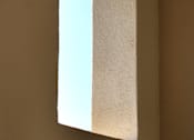 Thumbnail 29 of 45 - A white paper is folded in half and placed on a brown surface.