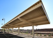 Thumbnail 30 of 45 - A long wooden covered walkway.