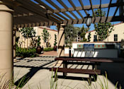 Thumbnail 42 of 45 - A wooden pergola with a metal roof is over a patio with a table and chairs.