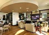Thumbnail 112 of 126 - A living room with a curved ceiling and furniture.