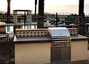 Thumbnail 52 of 126 - A barbecue grill is on a table outside.