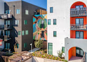 Thumbnail 7 of 16 - A building with a mural of a deer on it.