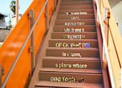 Thumbnail 7 of 11 - A set of stairs with words written on them.