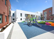 Thumbnail 13 of 17 - A playground area with a slide and a ball pit.