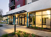 Thumbnail 8 of 102 - A modern building with a red and white facade and a sign that reads "VILLA".