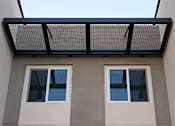Thumbnail 42 of 102 - A building with a flat roof and three windows.