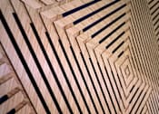 Thumbnail 73 of 102 - A wooden surface with black lines creating a geometric pattern.