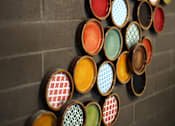 Thumbnail 75 of 94 - A wall of framed glasses with different colors and patterns.