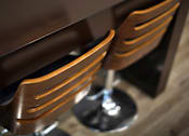 Thumbnail 83 of 94 - Two brown chairs with metal legs are placed next to a wooden table.