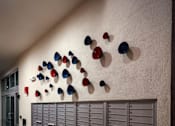 Thumbnail 71 of 94 - A wall of mailboxes with a row of mailboxes below it.