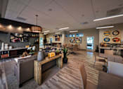 Thumbnail 63 of 94 - A modern kitchen with a wooden island and bar stools.