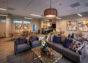 Thumbnail 61 of 94 - A modern living room with a grey couch and a wooden coffee table.