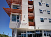Thumbnail 17 of 94 - A white and orange building with the words "Tower Bridge Gateway" on the front.