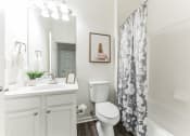 Thumbnail 15 of 44 - a white bathroom with a shower curtain and a toilet  at Cumberland Crossing, Cumberland, Rhode Island