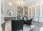Thumbnail 25 of 44 - a living room with white pillars and a table and chairs  at Cumberland Crossing, Cumberland, 02864
