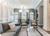 Thumbnail 23 of 44 - a living room with a couch and a glass table  at Cumberland Crossing, Cumberland, 02864