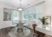 Thumbnail 6 of 44 - a dining room with a table and chairs and a window  at Cumberland Crossing, Rhode Island