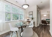 Thumbnail 5 of 44 - a dining room with a glass table and chairs  at Cumberland Crossing, Cumberland, 02864