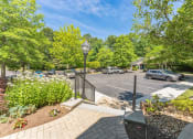 Thumbnail 22 of 44 - a parking lot with cars in it and trees at Cumberland Crossing, Cumberland, 02864