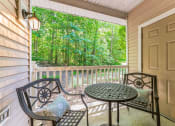 Thumbnail 18 of 44 - a patio with a table and chairs on a porch  at Cumberland Crossing, Rhode Island, 02864