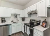 Thumbnail 2 of 44 - the preserve at ballantyne commons apartment kitchen with stainless steel appliances  at Cumberland Crossing, Rhode Island
