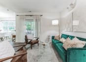 Thumbnail 10 of 44 - living room with a green couch at Cumberland Crossing, Cumberland, 02864