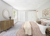Thumbnail 6 of 21 - A bedroom with a bed, nightstand, carpeting and dresser at Birchwood Hills Townhomes in Shirley, MA.