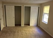 Thumbnail 19 of 21 - Birchwood Hills Townhomes Bedroom with carpet flooring and two large closets.