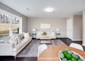 Thumbnail 7 of 14 - a living room with white couches and a wooden table at Pleasant View Estates, Griswold, 06351
