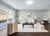 Thumbnail 9 of 14 - a living room with a couch and a table at Pleasant View Estates, Griswold