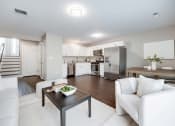 Thumbnail 3 of 14 - a living room and kitchen with white furniture at Pleasant View Estates, Griswold, 06351