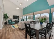 Thumbnail 3 of 57 - A dining room with a wooden table and chairs. at South Winds Apartments, Fall River, MA