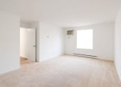 Thumbnail 49 of 57 - A room with a carpeted floor and a window. at South Winds Apartments, Fall River, Massachusetts