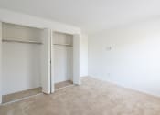 Thumbnail 53 of 57 - A room with a carpeted floor and white walls. at South Winds Apartments, Massachusetts, 02720