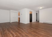 Thumbnail 46 of 57 - A room with wooden floors and white walls. at South Winds Apartments, Massachusetts