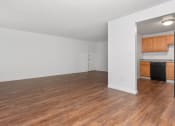 Thumbnail 45 of 57 - A room with wooden floors and white walls. at South Winds Apartments, Fall River, MA