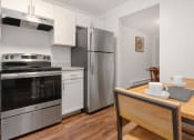 Thumbnail 24 of 57 - A modern kitchen with a stainless steel oven and refrigerator. at South Winds Apartments, Fall River, MA, 02720