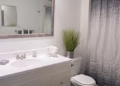Thumbnail 27 of 27 - a bathroom with a toilet and a sink and a shower