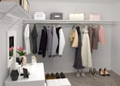 Thumbnail 21 of 27 - a walk in closet filled with clothes and shoes