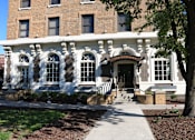 Thumbnail 10 of 10 - A building with a white facade and a sign that reads "The Habersham.".
