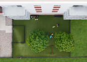 Thumbnail 30 of 32 - A man and a woman are playing badminton in a green yard.