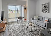 Thumbnail 4 of 32 - The Scott living room setup furnished with sliding door