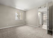 Thumbnail 19 of 24 - a empty room with a door to a hallway and a closet