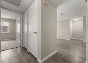 Thumbnail 16 of 24 - a renovated living room with white walls and wood floors