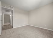 Thumbnail 21 of 24 - an empty living room with white walls and carpet